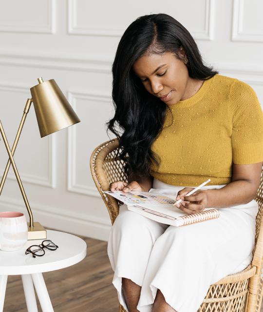 Woman sitting and smiling at an office